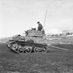 A_British_Light_Tank_Mk_VI,_wearing_distinctive_camouflage,_on_a_firing_range_on_Malta,_24_Mar...jpg